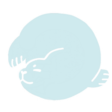 A seal swimming and forming a circle with it's body.